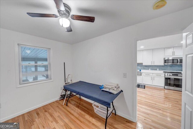 game room featuring ceiling fan and light hardwood / wood-style flooring