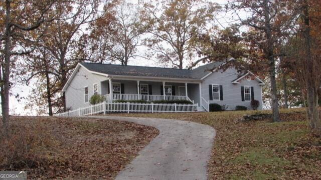 single story home featuring covered porch