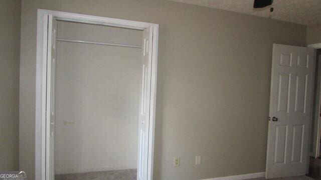 unfurnished bedroom featuring a closet