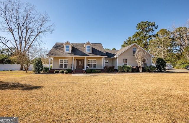 cape cod home with a porch and a front yard