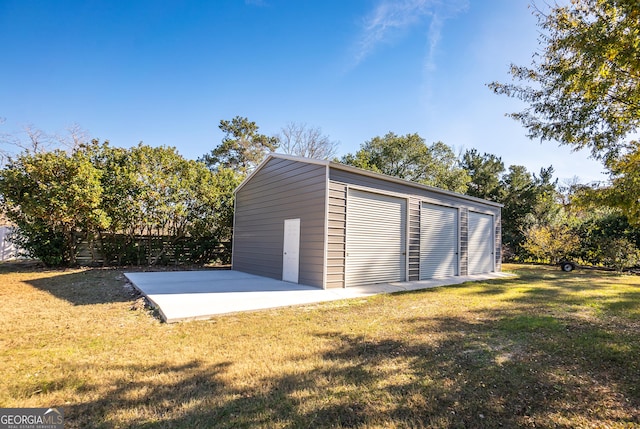 garage featuring a lawn