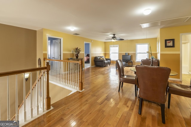 dining room featuring ceiling fan and light hardwood / wood-style floors