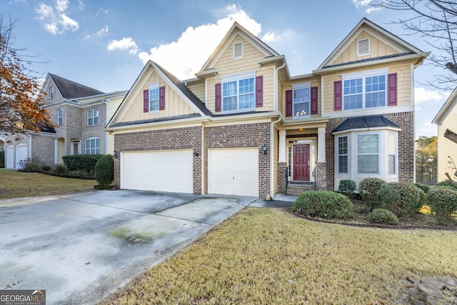 view of front of property with a front lawn and a garage