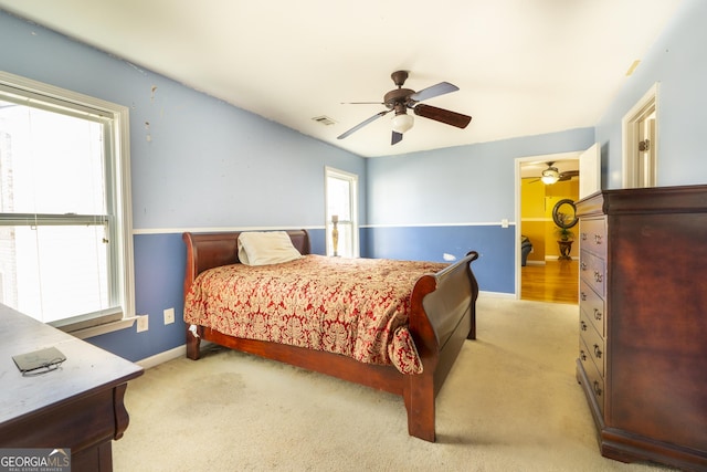 carpeted bedroom with ceiling fan