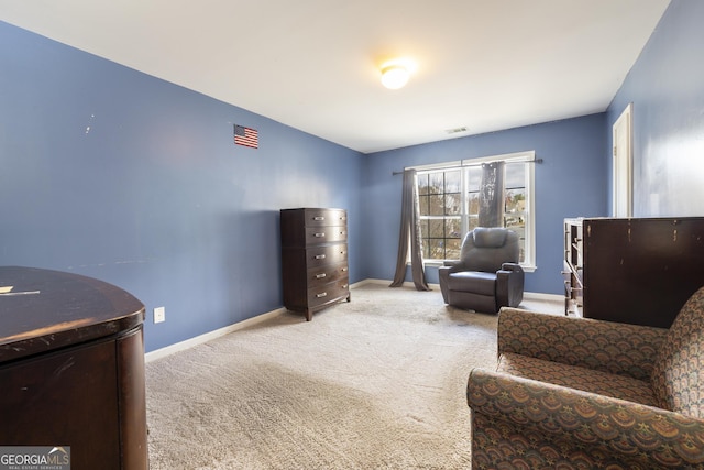 living area featuring light colored carpet