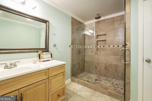 bathroom featuring vanity, tile patterned floors, an enclosed shower, and ornamental molding