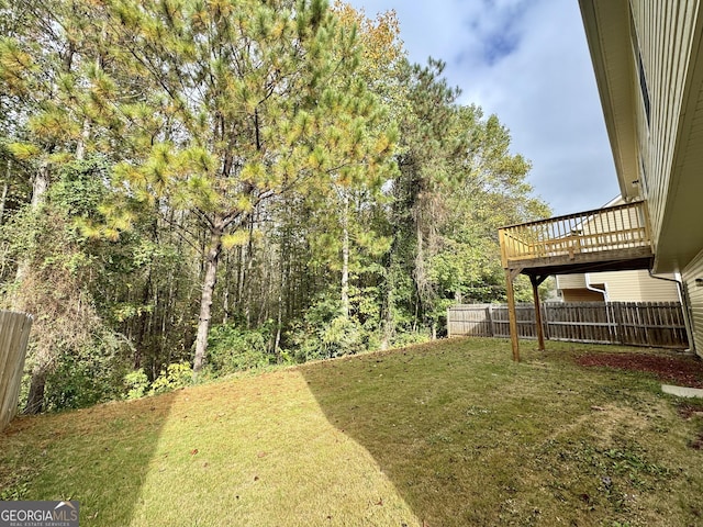 view of yard with a wooden deck