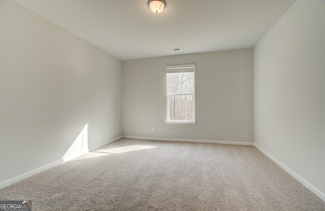 view of carpeted spare room