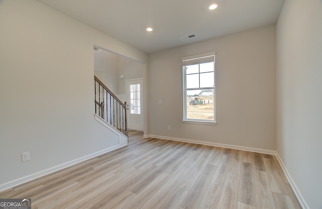 unfurnished room featuring light wood-type flooring