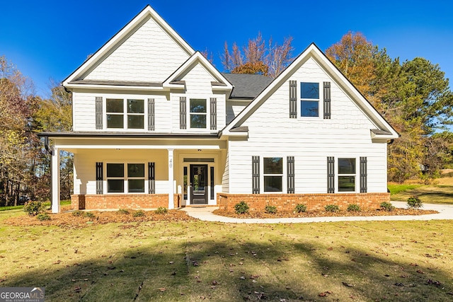 view of front of home with a front lawn and a porch