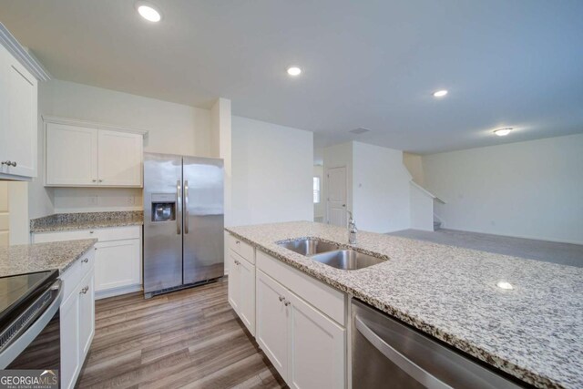 bathroom featuring hardwood / wood-style flooring, sink, and toilet