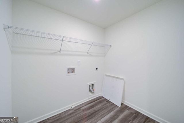 clothes washing area featuring hookup for an electric dryer, washer hookup, dark hardwood / wood-style floors, and gas dryer hookup