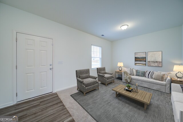 spare room featuring dark colored carpet