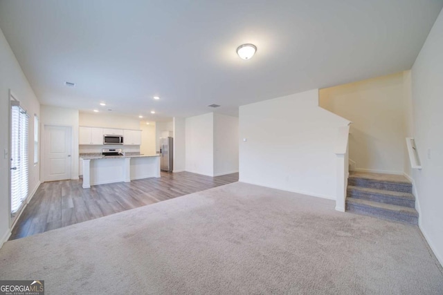 unfurnished living room with light wood-type flooring