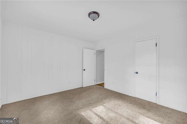 unfurnished bedroom featuring carpet