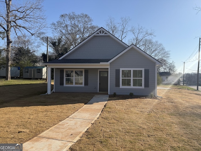 bungalow-style house with a front lawn