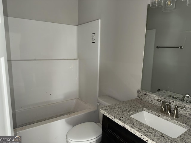 full bathroom with toilet and vanity