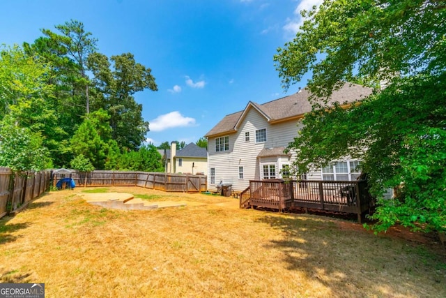 view of yard featuring a wooden deck