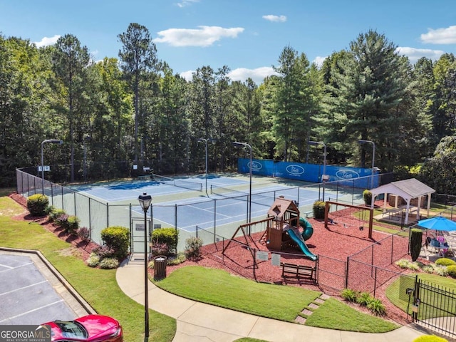 view of sport court featuring a playground