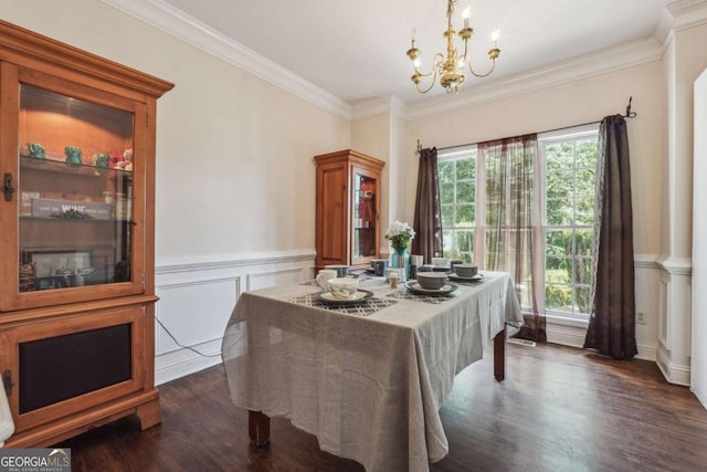 dining space featuring a chandelier, dark hardwood / wood-style flooring, and crown molding