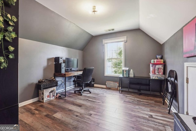 office with dark hardwood / wood-style flooring and vaulted ceiling