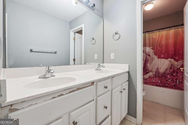 full bathroom featuring tile patterned flooring, vanity, toilet, and shower / bathtub combination with curtain