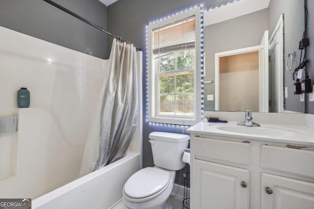 full bathroom featuring shower / tub combo, vanity, and toilet