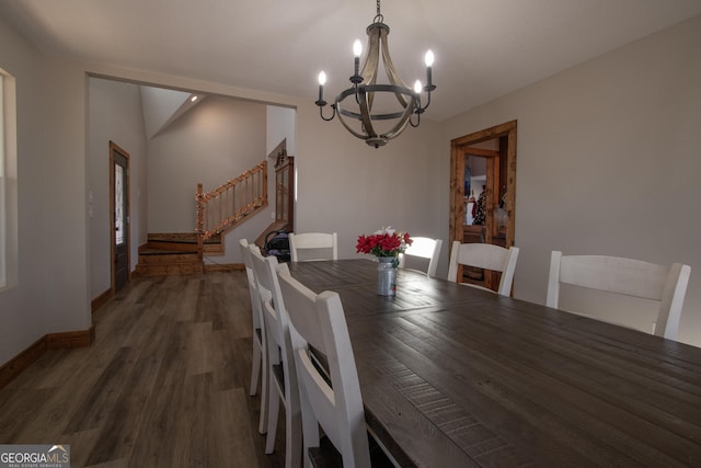 dining room featuring dark hardwood / wood-style flooring, an inviting chandelier, and a wealth of natural light