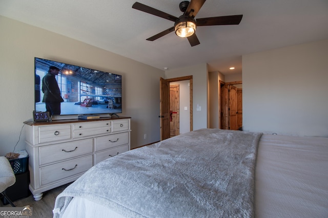 bedroom featuring ceiling fan and a closet