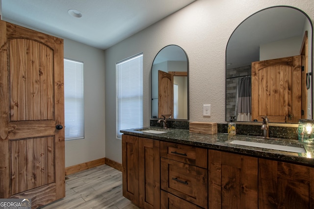 bathroom with hardwood / wood-style floors, vanity, and a shower with shower curtain