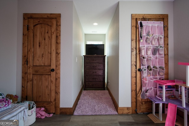 corridor with wood-type flooring