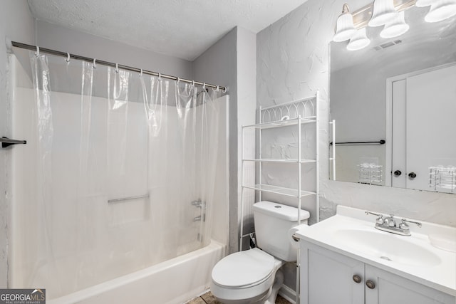 full bathroom with a textured ceiling, toilet, shower / bath combo with shower curtain, vanity, and tile walls