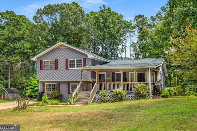 split level home featuring covered porch and a front yard