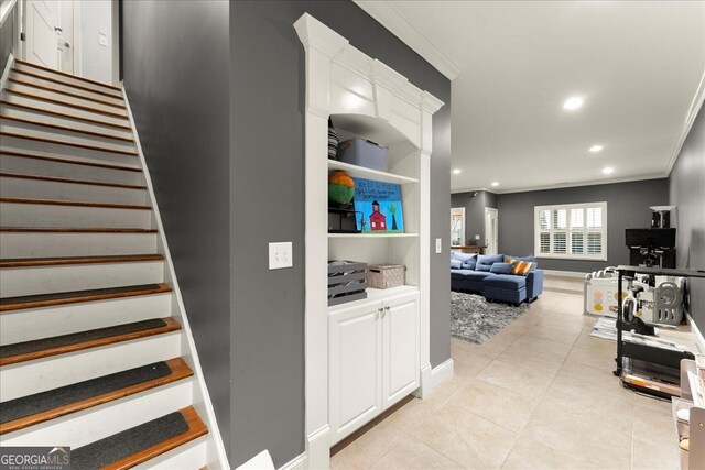 tiled living room with ornamental molding