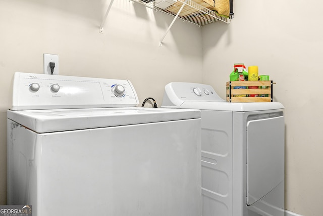 laundry room featuring washer and clothes dryer