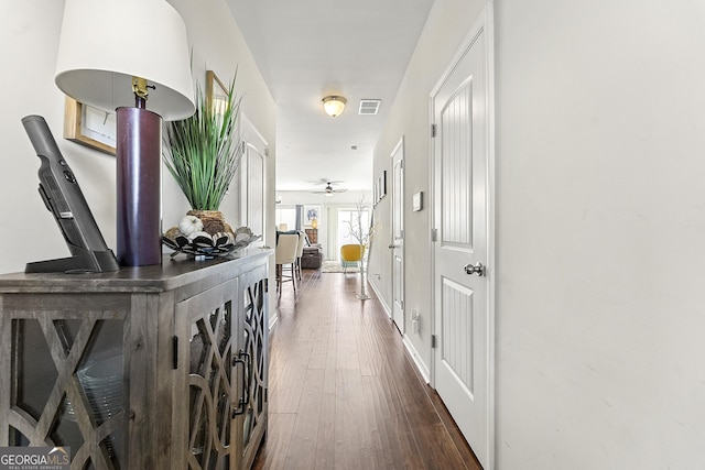 hallway featuring dark hardwood / wood-style floors