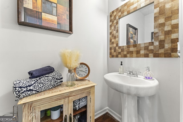 bathroom with sink and wood-type flooring