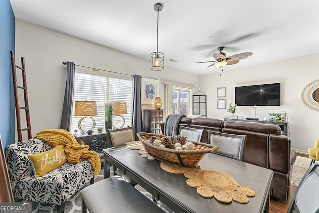 dining room featuring hardwood / wood-style floors and ceiling fan