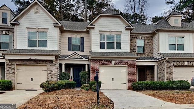 townhome / multi-family property featuring a garage