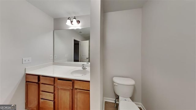 bathroom with vanity and toilet