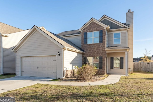 view of front of house featuring a front yard and a garage