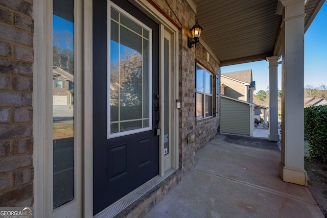 doorway to property with covered porch