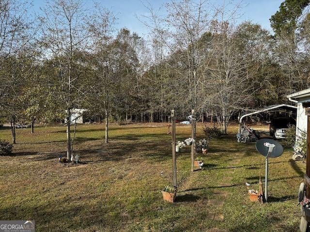 view of yard with a carport