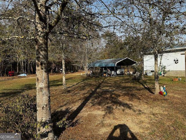 view of yard with a carport