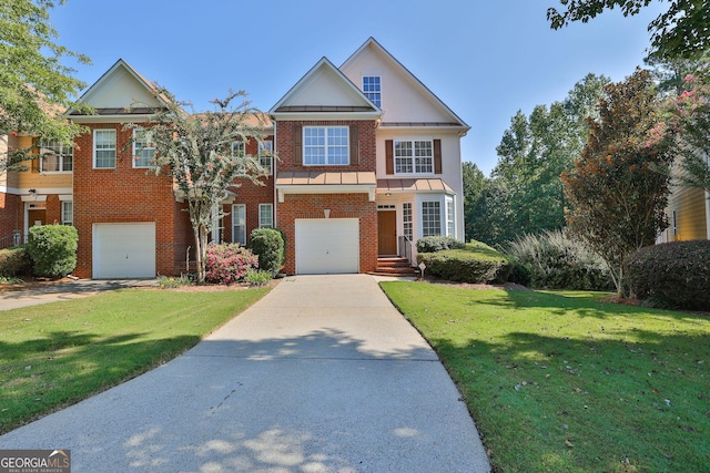 view of front of house with a front lawn and a garage