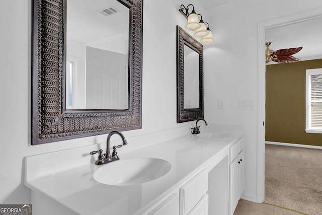 bathroom featuring vanity and ornamental molding