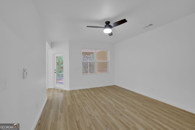 spare room featuring light wood-type flooring and ceiling fan