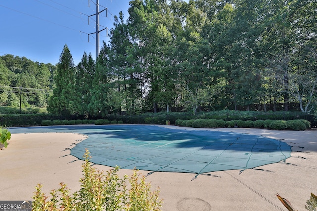 view of pool featuring a patio area