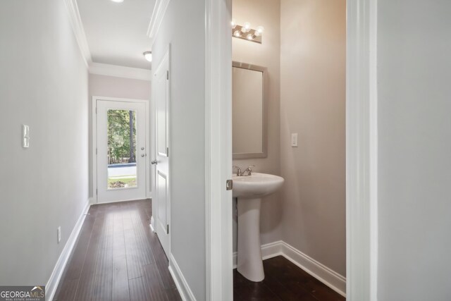 bathroom with ornamental molding and hardwood / wood-style floors