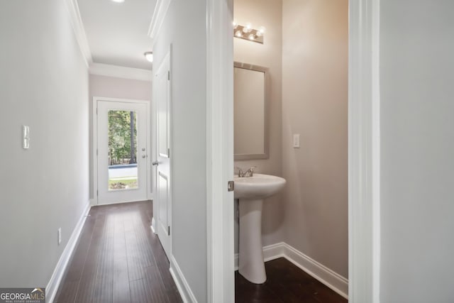 bathroom featuring hardwood / wood-style flooring and crown molding